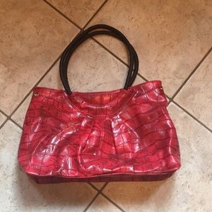 Red purse with brown strap